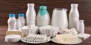 Different dairy products on wooden table